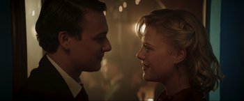 Movie still from “Lamborghini: The Man Behind the Legend” (2022), directed by Bobby Moresco – A man and a woman looking at each other; Close Up shot, Over the shoulder angle