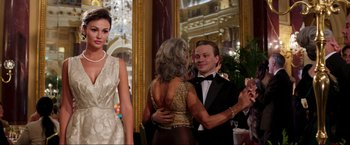 Movie still from “Lamborghini: The Man Behind the Legend” (2022), directed by Bobby Moresco – A man and a woman in formal wear dancing together; Medium shot, Over the shoulder angle