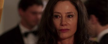 Movie still from “Lamborghini: The Man Behind the Legend” (2022), directed by Bobby Moresco – A person with long hair; Close Up shot, Over the shoulder angle