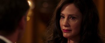 Movie still from “Lamborghini: The Man Behind the Legend” (2022), directed by Bobby Moresco – A person with long brown hair; Close Up shot, Over the shoulder angle