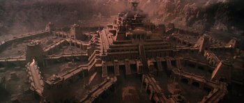 Movie still from “Lara Croft: Tomb Raider” (2001), directed by Simon West – An aerial view of an ancient city with many buildings; Extreme Wide shot, High angle