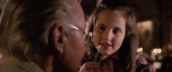 Movie still from “Lara Croft: Tomb Raider” (2001), directed by Simon West – An older man and a young girl looking at each other; Close Up shot, Over the shoulder angle