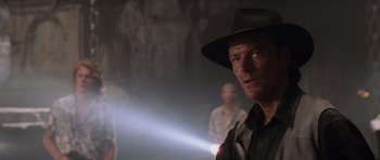 Movie still from “Lara Croft: Tomb Raider” (2001), directed by Simon West – A person wearing a hat; Close Up shot, Over the shoulder angle