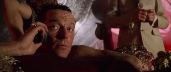 Movie still from “Lara Croft: Tomb Raider” (2001), directed by Simon West – A person laying on a bed; Close Up shot, Low angle