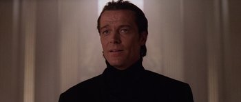 Movie still from “Lara Croft: Tomb Raider” (2001), directed by Simon West – A person wearing a black shirt; Close Up shot, Low angle