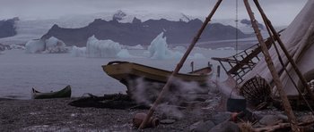 Movie still from “Lara Croft: Tomb Raider” (2001), directed by Simon West – An old wooden boat sitting on top of a body of water; Extreme Wide shot, Low angle