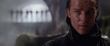 Movie still from “Lara Croft: Tomb Raider” (2001), directed by Simon West – A person wearing a black jacket; Close Up shot, Low angle