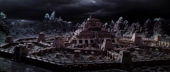 Movie still from “Lara Croft: Tomb Raider” (2001), directed by Simon West – A model of an ancient city with a dark sky background; Extreme Wide shot, High angle