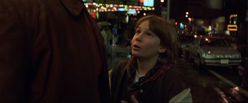 Movie still from “Last Action Hero” (1993), directed by John McTiernan – A young boy is looking up at the lights; Close Up shot, Over the shoulder angle