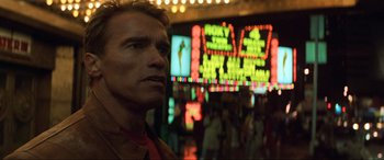 Movie still from “Last Action Hero” (1993), directed by John McTiernan – A man standing in front of a crowd of people; Close Up shot, Low angle