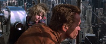 Movie still from “Last Action Hero” (1993), directed by John McTiernan – A young man and a young man in a city setting; Close Up shot, Low angle