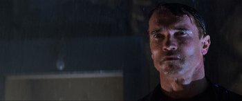 Movie still from “Last Action Hero” (1993), directed by John McTiernan – A person with a wet shirt on; Close Up shot, Low angle