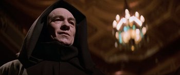 Movie still from “Last Action Hero” (1993), directed by John McTiernan – A person wearing a black robe; Close Up shot, Low angle