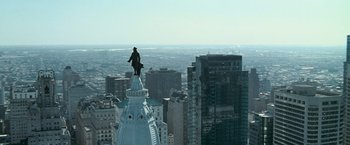 Movie still from “Law Abiding Citizen” (2009), directed by F. Gary Gray – A man standing on the top of a white building; Extreme Wide shot, High angle