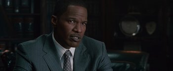 Movie still from “Law Abiding Citizen” (2009), directed by F. Gary Gray – A person wearing a suit and tie; Close Up shot, High angle