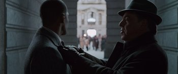 Movie still from “Law Abiding Citizen” (2009), directed by F. Gary Gray – Two men are talking in the street; Close Up shot, Over the shoulder angle
