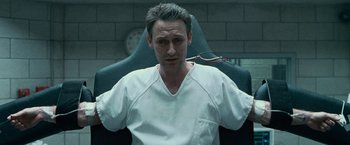 Movie still from “Law Abiding Citizen” (2009), directed by F. Gary Gray – A man in white shirt sitting in a chair; Close Up shot, High angle