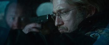 Movie still from “Law Abiding Citizen” (2009), directed by F. Gary Gray – A person holding a gun; Close Up shot, Over the shoulder angle