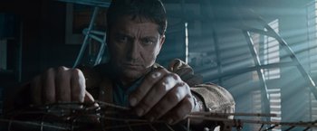 Movie still from “Law Abiding Citizen” (2009), directed by F. Gary Gray – A person holding a branch; Close Up shot, Low angle