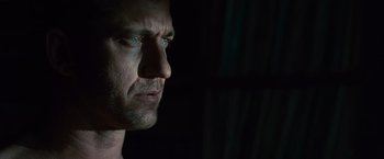 Movie still from “Law Abiding Citizen” (2009), directed by F. Gary Gray – A man's face in the dark; Close Up shot, Low angle