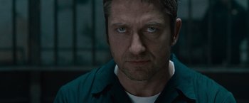 Movie still from “Law Abiding Citizen” (2009), directed by F. Gary Gray – A person wearing a blue shirt; Close Up shot, Low angle