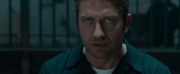 Movie still from “Law Abiding Citizen” (2009), directed by F. Gary Gray – A person wearing a blue shirt; Close Up shot, Low angle