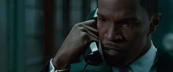 Movie still from “Law Abiding Citizen” (2009), directed by F. Gary Gray – A person talking on a cell phone; Close Up shot, High angle