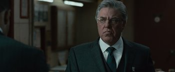 Movie still from “Law Abiding Citizen” (2009), directed by F. Gary Gray – An older man wearing a suit and tie; Close Up shot, Low angle