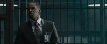 Movie still from “Law Abiding Citizen” (2009), directed by F. Gary Gray – A man in a suit and tie; Close Up shot, Over the shoulder angle