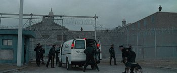 Movie still from “Law Abiding Citizen” (2009), directed by F. Gary Gray – A group of men standing next to a white van; Extreme Wide shot, High angle
