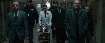Movie still from “Law Abiding Citizen” (2009), directed by F. Gary Gray – A group of men walking down a hall way; Medium shot, Low angle