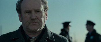 Movie still from “Law Abiding Citizen” (2009), directed by F. Gary Gray – A person wearing a suit and tie; Close Up shot, Low angle