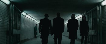 Movie still from “Law Abiding Citizen” (2009), directed by F. Gary Gray – A group of people walking down a tunnel; Wide shot, Low angle
