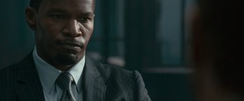 Movie still from “Law Abiding Citizen” (2009), directed by F. Gary Gray – A person wearing a suit and tie; Close Up shot, Over the shoulder angle