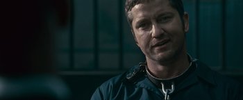 Movie still from “Law Abiding Citizen” (2009), directed by F. Gary Gray – A person wearing a jacket; Close Up shot, Over the shoulder angle