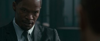 Movie still from “Law Abiding Citizen” (2009), directed by F. Gary Gray – A person wearing a suit and tie; Close Up shot, Over the shoulder angle