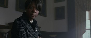 Movie still from “Law Abiding Citizen” (2009), directed by F. Gary Gray – A woman in a polka dot jacket standing in a room; Close Up shot, Low angle