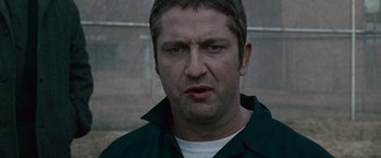 Movie still from “Law Abiding Citizen” (2009), directed by F. Gary Gray – A person wearing a black shirt; Close Up shot, Low angle