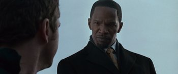 Movie still from “Law Abiding Citizen” (2009), directed by F. Gary Gray – A man wearing a suit and tie looking at another man; Close Up shot, Over the shoulder angle
