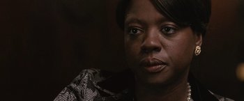 Movie still from “Law Abiding Citizen” (2009), directed by F. Gary Gray – A person wearing a dress; Close Up shot, Over the shoulder angle