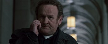 Movie still from “Law Abiding Citizen” (2009), directed by F. Gary Gray – A person holding a cell phone to his ear; Close Up shot, Low angle