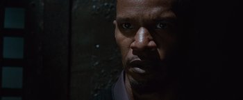 Movie still from “Law Abiding Citizen” (2009), directed by F. Gary Gray – A man's face in the dark; Close Up shot, Over the shoulder angle