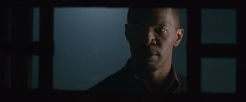 Movie still from “Law Abiding Citizen” (2009), directed by F. Gary Gray – A person wearing a black shirt; Close Up shot, Low angle