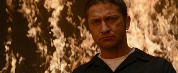 Movie still from “Law Abiding Citizen” (2009), directed by F. Gary Gray – A person wearing a black shirt; Close Up shot, Low angle