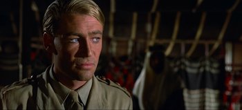 Movie still from “Lawrence of Arabia” (1962), directed by David Lean – A person wearing a military uniform; Close Up shot, Over the shoulder angle