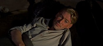 Movie still from “Lawrence of Arabia” (1962), directed by David Lean – A person wearing a shirt; Close Up shot, High angle