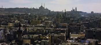Movie still from “Lawrence of Arabia” (1962), directed by David Lean – An aerial view of an old city with a mosque in the background; Extreme Wide shot, High angle