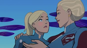Movie still from “Legion of Super-Heroes” (2023), directed by Jeff Wamester – A woman and a man are hugging in front of a sky background; Close Up shot, Over the shoulder angle