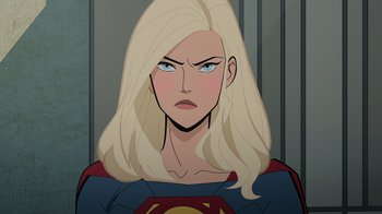 Movie still from “Legion of Super-Heroes” (2023), directed by Jeff Wamester – A woman with blonde hair and a blue shirt; Close Up shot, Over the shoulder angle
