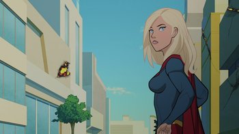 Movie still from “Legion of Super-Heroes” (2023), directed by Jeff Wamester – A woman standing on a city street looking at a butterfly; Medium shot, Over the shoulder angle
